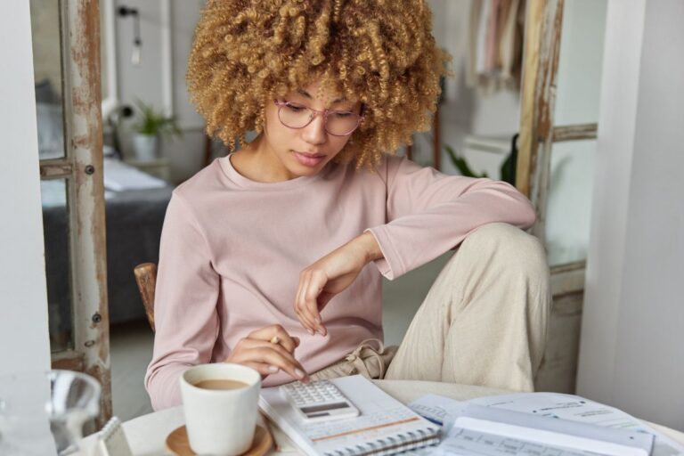 woman paying bills at home