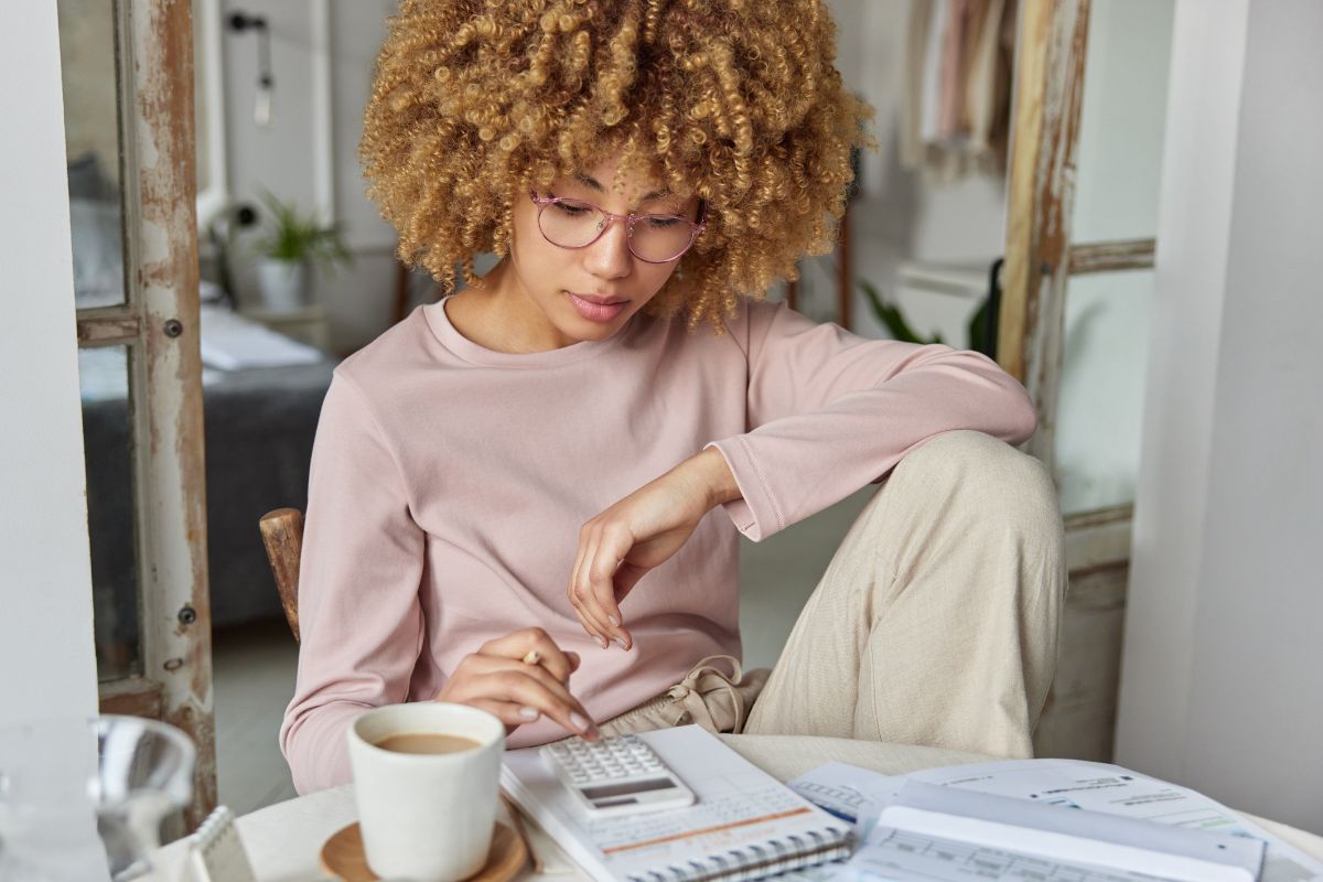 woman paying bills at home