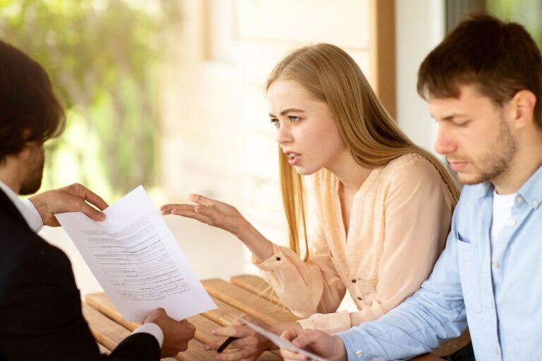 couple asking for explanation on a bill with a financial advisor