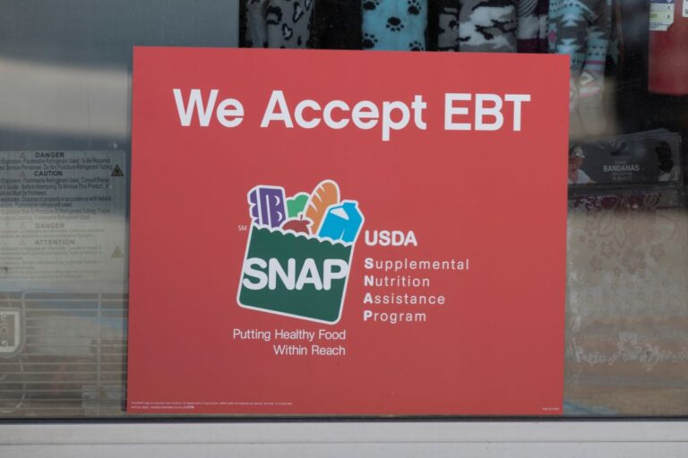 sign saying we accept ebt SNAP on a window