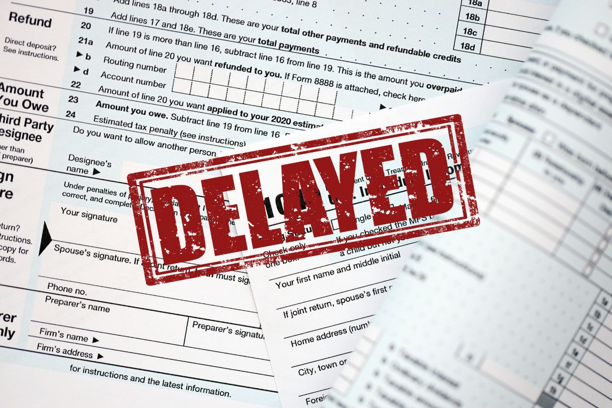 tax forms with a delayed stamp on it