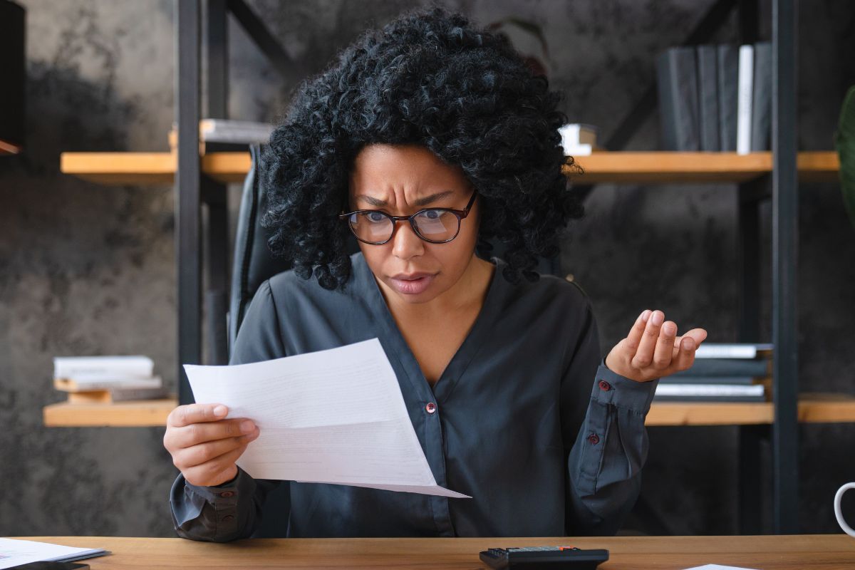Woman looking confused at her paper