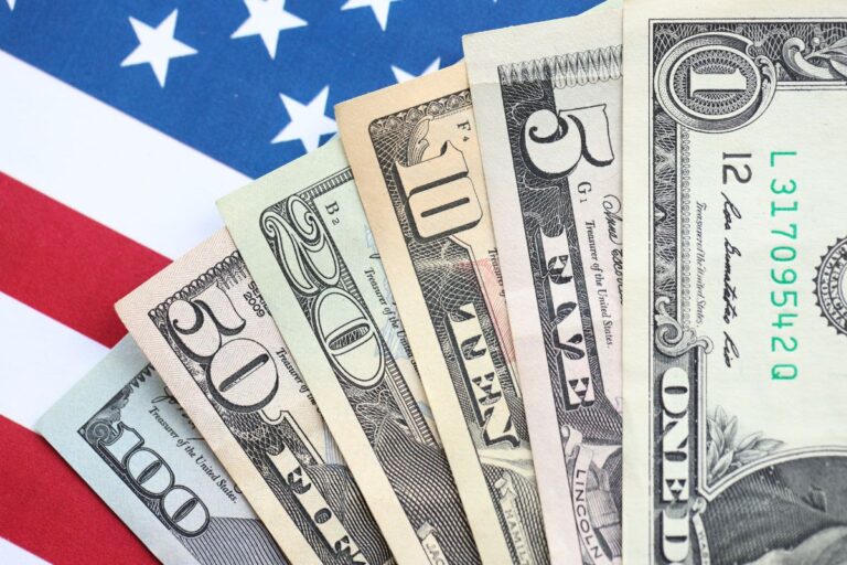 usa bills ontop of an America flag