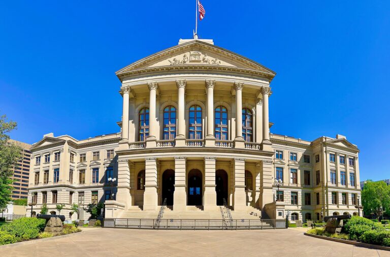 The front of the Georgia State Capitol building in Atlanta with its gold dome