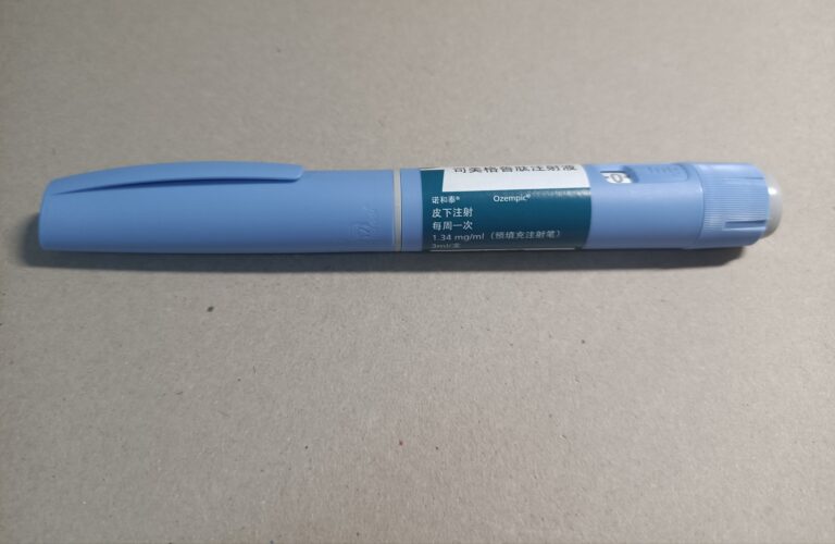 An Ozempic 3 ml injection pen on a table