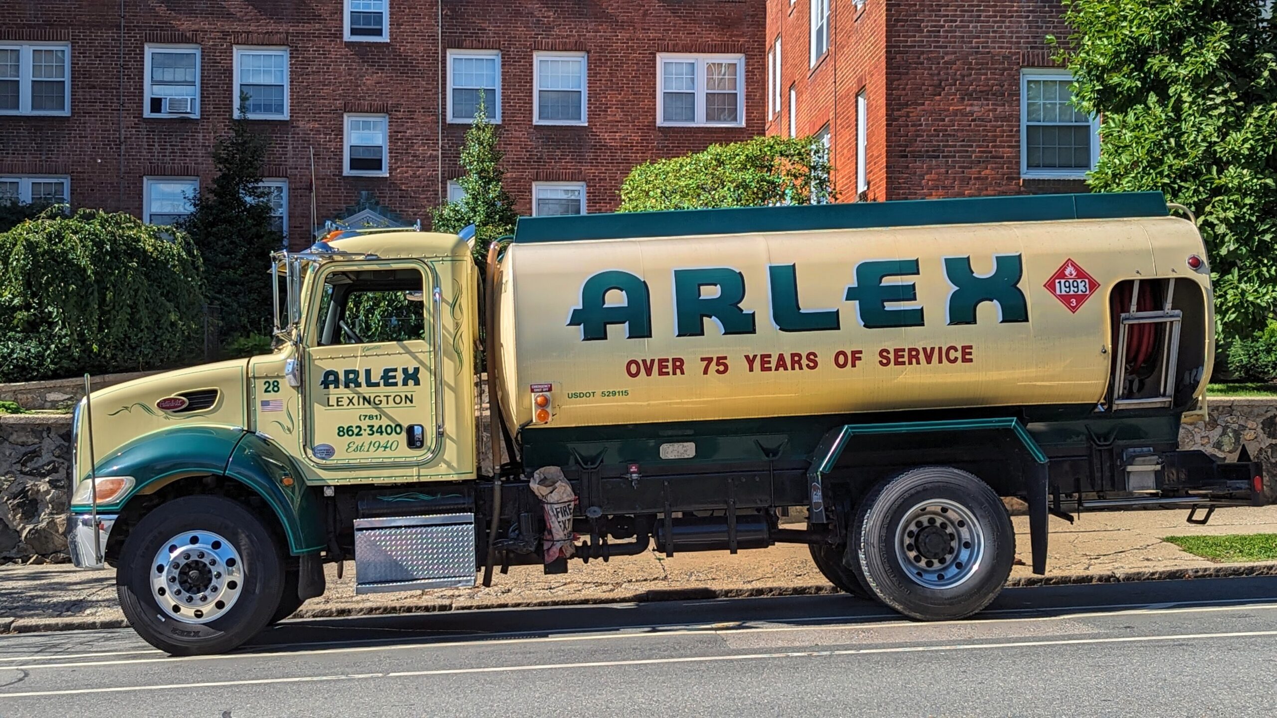 A heating oil delivery truck parked on a residential street